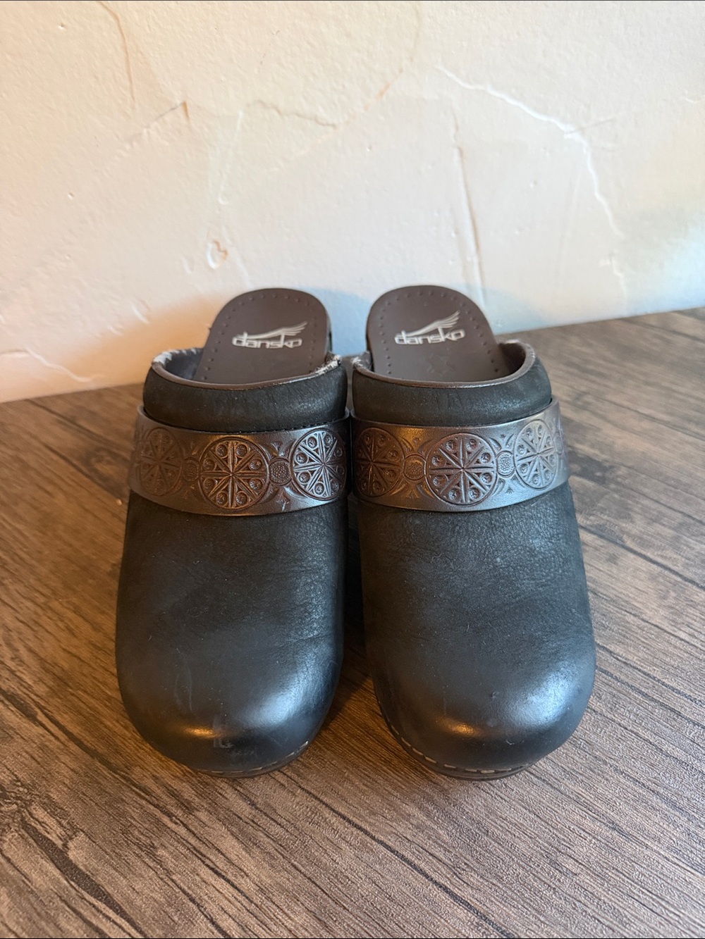Dansko Black Leather Clogs with Embossed Brown Band